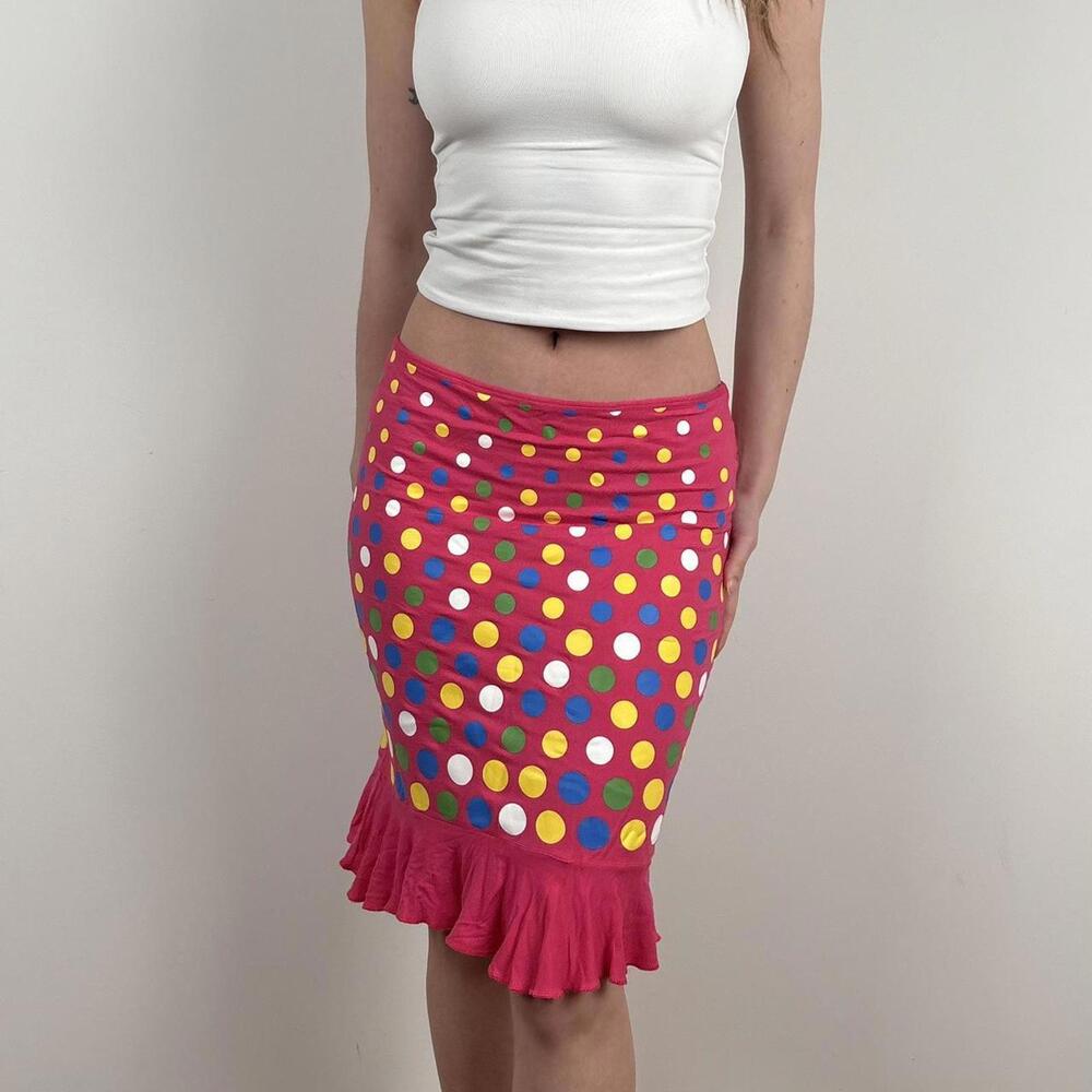 Pink polka dot midi skirt with ruffle hem.